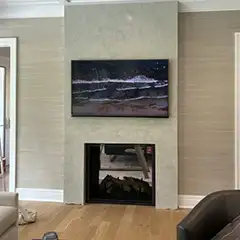 Applicator: Yi Ping Boaro. Product: Grasselo Fino (living room fireplace wall). Location: Sands Point, NY.